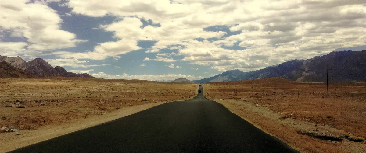 The Srinagar–Leh highway approaching Magnetic Hill with mountains ahead