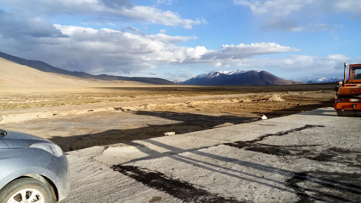 Open high desert plain near Pang under a cloudy sky
