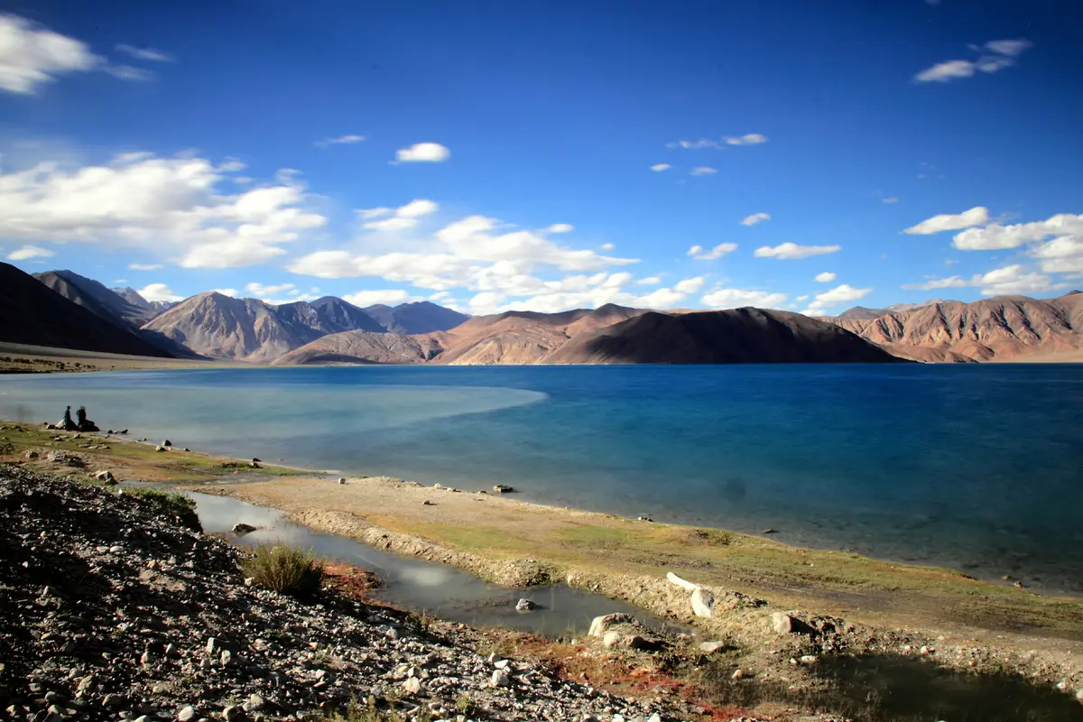 Late afternoon light on Pangong Tso with mountains reflected in the water