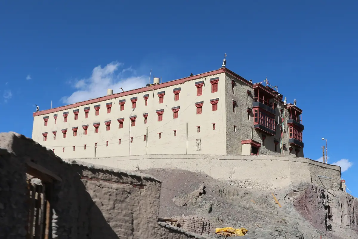 Stok Palace on a hillside near Leh with mountains behind