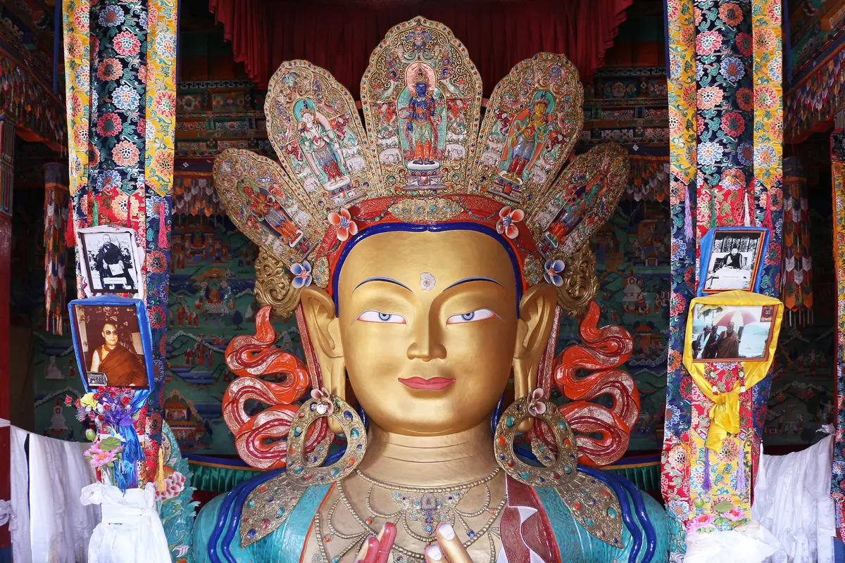 Golden face and crown of the Maitreya Buddha statue at Thiksey Monastery