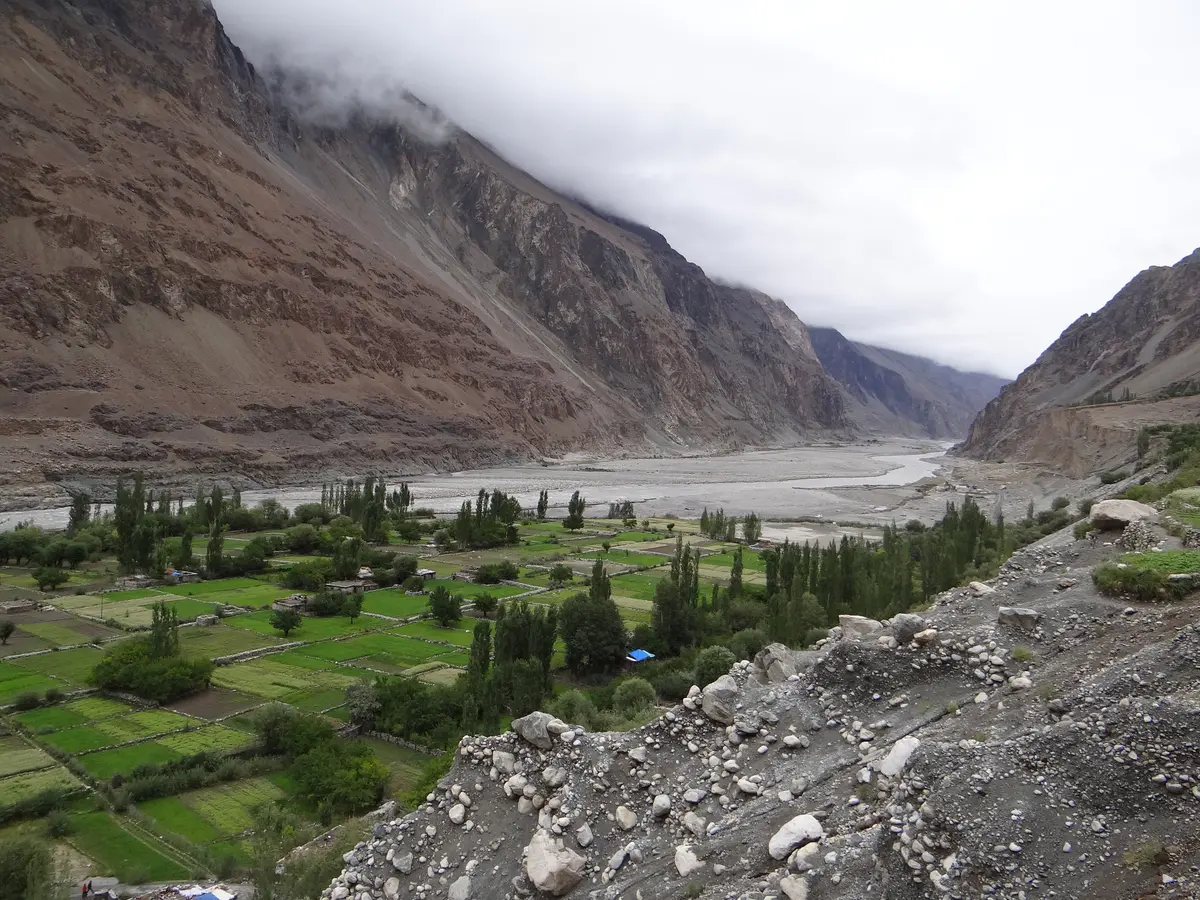 The Shyok river flowing past Turtuk village with mountains on both sides