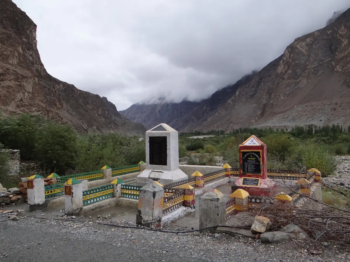 A war memorial in Turtuk village with mountains behind