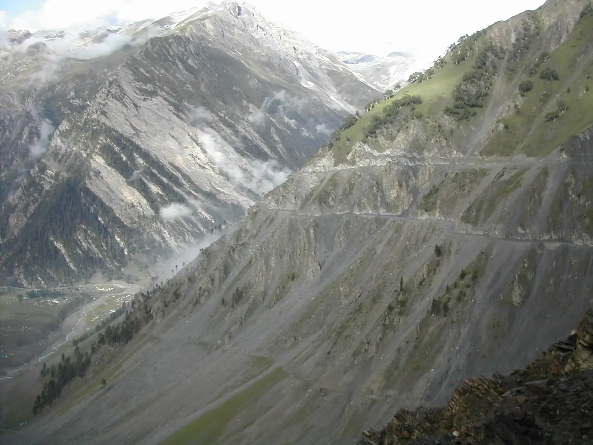 Road cut into steep mountainsides on the approach to Zojila
